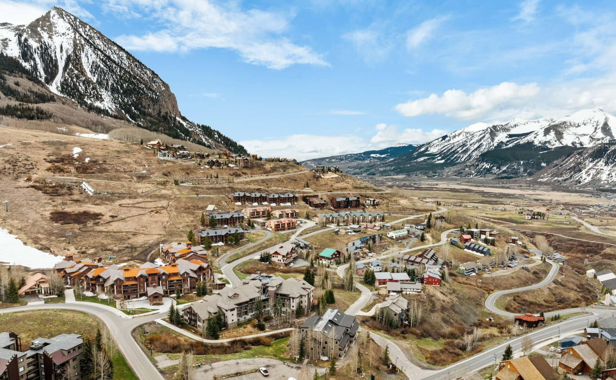 Aerial view of Mt. Crested Butte base area and False Summit CB condo building below the Crested Butte peak
